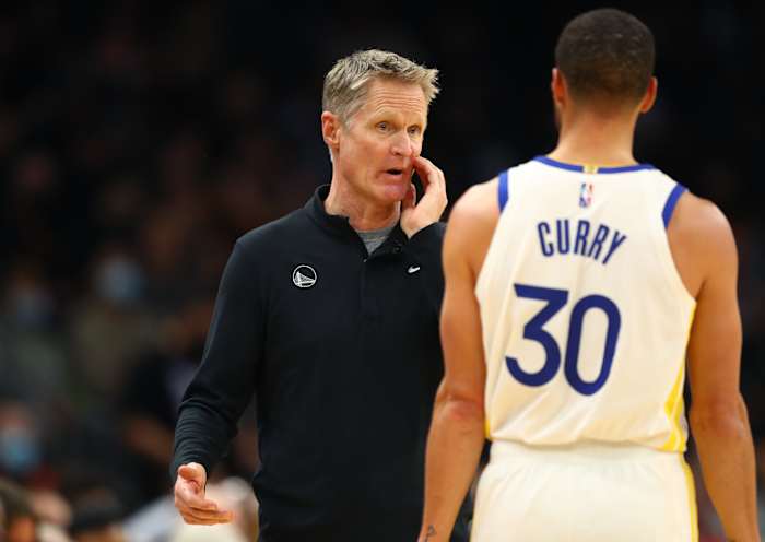 Nov 30, 2021; Phoenix, Arizona, USA; Golden State Warriors head coach Steve Kerr with guard Stephen Curry (30) against the Phoenix Suns at Footprint Center.